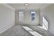 Cozy bedroom featuring neutral walls, carpeting, and a window offering natural light at 1924 Wilkenson Xing, Marietta, GA 30066