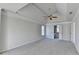 Spacious bedroom featuring neutral walls, carpeting, a fan and an open bathroom at 1924 Wilkenson Xing, Marietta, GA 30066