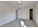 Spacious bedroom with carpet flooring, showcasing the potential for comfortable living at 1924 Wilkenson Xing, Marietta, GA 30066