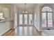 Dining room with a chandelier and large windows with views of the backyard at 1924 Wilkenson Xing, Marietta, GA 30066