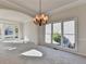 Spacious dining area with chandelier is adjacent to living room and kitchen at 1924 Wilkenson Xing, Marietta, GA 30066