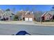 Charming two-story brick home with a well-manicured lawn, two-car garage, and a welcoming front entrance at 1924 Wilkenson Xing, Marietta, GA 30066