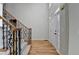 Bright foyer with hardwood floors, decorative staircase, and a front door with decorative glass inserts at 1924 Wilkenson Xing, Marietta, GA 30066