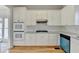 Well-lit kitchen boasts white cabinets, granite countertops, and stainless steel double oven at 1924 Wilkenson Xing, Marietta, GA 30066