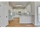Bright, open kitchen area featuring granite countertops and modern appliances at 1924 Wilkenson Xing, Marietta, GA 30066