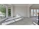 Bright living room with large windows providing natural light and neutral carpet at 1924 Wilkenson Xing, Marietta, GA 30066