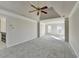 Spacious main bedroom featuring a ceiling fan, neutral walls, and two windows providing plenty of natural light at 1924 Wilkenson Xing, Marietta, GA 30066