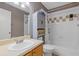 Well-lit bathroom featuring a vanity with a sink and a combined bathtub and shower at 3155 Seven Pines Ct # 303, Atlanta, GA 30339