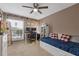 Bedroom with a ceiling fan, desk, and a window providing natural light at 3155 Seven Pines Ct # 303, Atlanta, GA 30339