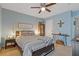 Comfortable bedroom with a decorative ceiling fan and accent lighting at 3155 Seven Pines Ct # 303, Atlanta, GA 30339