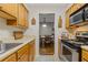 Galley kitchen featuring stainless appliances and a view into the dining area at 3155 Seven Pines Ct # 303, Atlanta, GA 30339