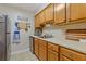 A cozy kitchen featuring light wood cabinets, stainless steel appliances, and tiled floor at 3155 Seven Pines Ct # 303, Atlanta, GA 30339