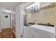 Bright laundry room featuring washer, dryer, and storage shelves at 3155 Seven Pines Ct # 303, Atlanta, GA 30339