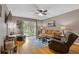 Cozy living room featuring hardwood floors, ceiling fan, access to a patio, and comfortable seating at 3155 Seven Pines Ct # 303, Atlanta, GA 30339