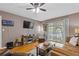 Living room features include hardwood floors, ceiling fan, TV and patio access at 3155 Seven Pines Ct # 303, Atlanta, GA 30339