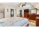 A bedroom with hardwood floors, ceiling fan, and furnishings at 4062 Silver Fir Ct, Marietta, GA 30066