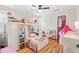 This bedroom includes hardwood floors, bunkbeds, and a play area at 4062 Silver Fir Ct, Marietta, GA 30066