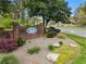 Brick sign for Whitfield Woods neighborhood featuring manicured landscaping at 4062 Silver Fir Ct, Marietta, GA 30066