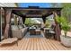Wooden deck featuring an outdoor lounge area with gazebo and seating at 4062 Silver Fir Ct, Marietta, GA 30066
