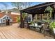 Wooden deck featuring an outdoor lounge area with a gazebo, seating, and a playhouse at 4062 Silver Fir Ct, Marietta, GA 30066