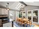Bright dining room featuring a skylight, large windows, and modern lighting fixture at 4062 Silver Fir Ct, Marietta, GA 30066