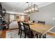 Open-concept dining room flowing into the living area with hardwood flooring at 4062 Silver Fir Ct, Marietta, GA 30066