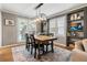 Dining room with custom built-ins and natural light from shuttered windows at 4062 Silver Fir Ct, Marietta, GA 30066