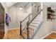 This foyer showcases hardwood floors, a staircase with white rails, and stylish decor at 4062 Silver Fir Ct, Marietta, GA 30066