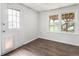 This sunroom features wood floors, natural lighting, and access to the backyard at 4062 Silver Fir Ct, Marietta, GA 30066