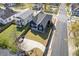 An aerial view shows the renovated home, a driveway, and a spacious green lawn at 459 James P Brawley Nw Dr, Atlanta, GA 30318