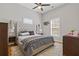 Comfortable bedroom features plush carpeting, neutral decor, and ample natural light at 459 James P Brawley Nw Dr, Atlanta, GA 30318