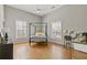 Vaulted ceiling bedroom with ceiling fan, hardwood floors, neutral decor and natural light at 459 James P Brawley Nw Dr, Atlanta, GA 30318