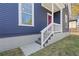 Charming home exterior with blue siding, white trim, and a pink front door at 459 James P Brawley Nw Dr, Atlanta, GA 30318