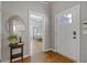 Inviting foyer with hardwood floors and views into the kitchen and bedroom at 459 James P Brawley Nw Dr, Atlanta, GA 30318