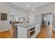 Kitchen island featuring granite countertop with built in stainless steel oven and seating at 459 James P Brawley Nw Dr, Atlanta, GA 30318