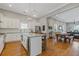 Open concept kitchen featuring a large island, stainless steel appliances, and hardwood floors at 459 James P Brawley Nw Dr, Atlanta, GA 30318