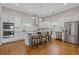 Modern kitchen with stainless steel appliances, granite countertops, and a center island with seating at 459 James P Brawley Nw Dr, Atlanta, GA 30318