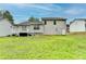 Spacious backyard featuring a deck and ample lawn space, great for entertaining guests at 5880 April Dr, Sugar Hill, GA 30518