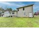 Sprawling backyard with deck and lawn, offering plenty of room for recreation and relaxation at 5880 April Dr, Sugar Hill, GA 30518