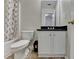 This bathroom features a vanity with black countertop and a tub with shower at 5880 April Dr, Sugar Hill, GA 30518
