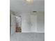 Neutral carpeted room with two access doors at 5880 April Dr, Sugar Hill, GA 30518