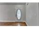 Bright entryway featuring beautiful hardwood floors and decorative front door at 5880 April Dr, Sugar Hill, GA 30518