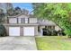 Charming two-story home with a two-car garage and a well-manicured front yard at 5880 April Dr, Sugar Hill, GA 30518
