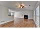Bright living room showcasing hardwood floors, a fireplace, and neutral paint at 5880 April Dr, Sugar Hill, GA 30518