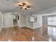 Spacious living room with hardwood floors, access to stairs, and natural light at 5880 April Dr, Sugar Hill, GA 30518