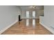 Bright living room showcasing hardwood floors, a fireplace, and neutral paint at 5880 April Dr, Sugar Hill, GA 30518