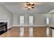 Spacious living room with vaulted ceilings, a fireplace, and hardwood floors at 5880 April Dr, Sugar Hill, GA 30518