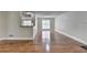 Spacious living room featuring hardwood floors and ample natural light, perfect for entertaining at 5880 April Dr, Sugar Hill, GA 30518