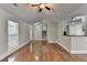 Inviting living room with hardwood floors, neutral walls, and an open concept design at 5880 April Dr, Sugar Hill, GA 30518