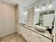 Bright bathroom with double sinks, stone countertops, and white cabinets at 1118 Magnolia Se Way, Smyrna, GA 30082
